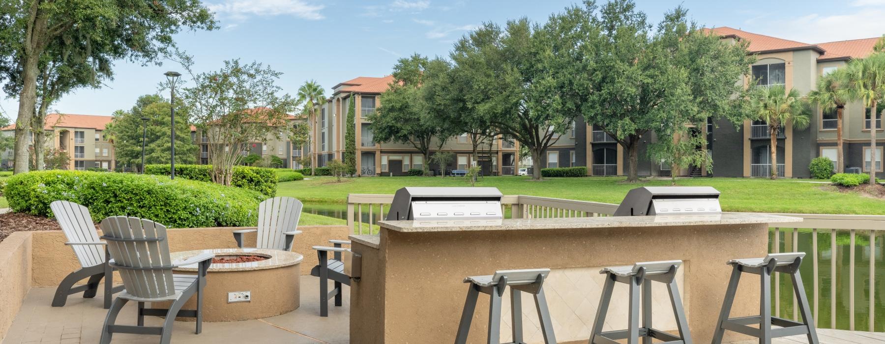 a table grills and chairs outside